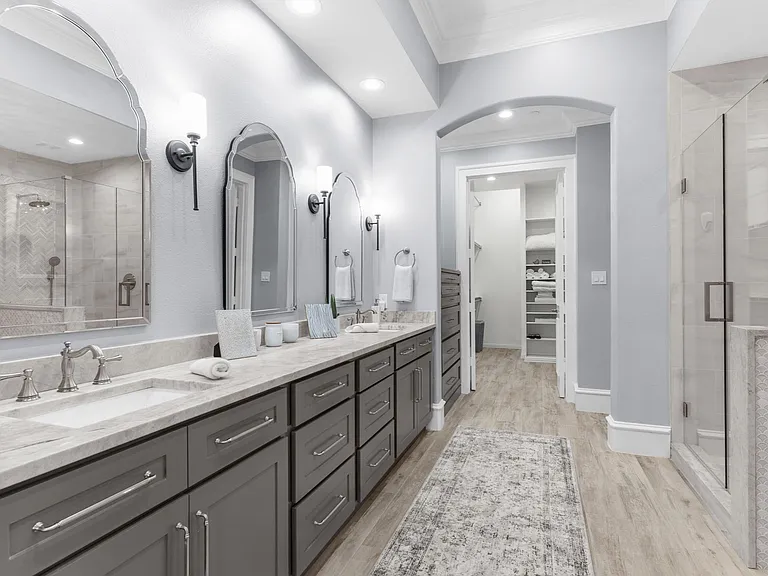 Ultimate relaxation awaits with a deep soaking tub and a modern glass shower.