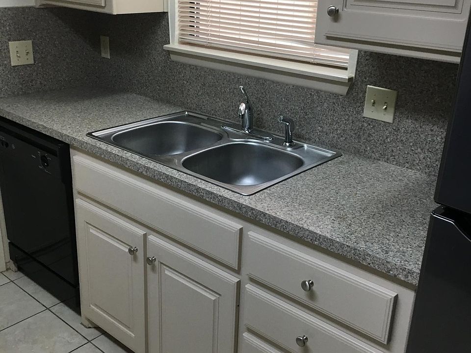 VIEW OF FRONT YARD FROM KITCHEN WINDOW. DISPOSAL, DISHWASHER, BUILT IN MICROWAVE, SELF CLEANING OVEN AND REFRIGERATOR