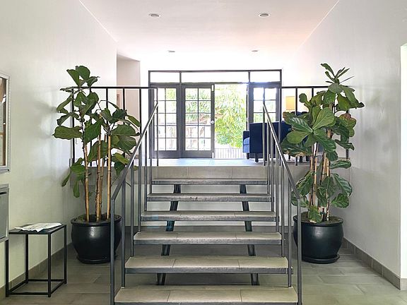 SECURED ENTRY, INTERIOR LOBBY VIEW. CLEAN AND MODERN.