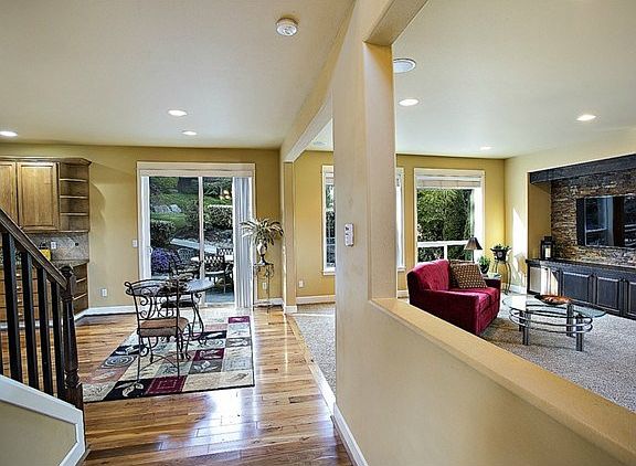 The custom entertainment center with stone wall feature takes th