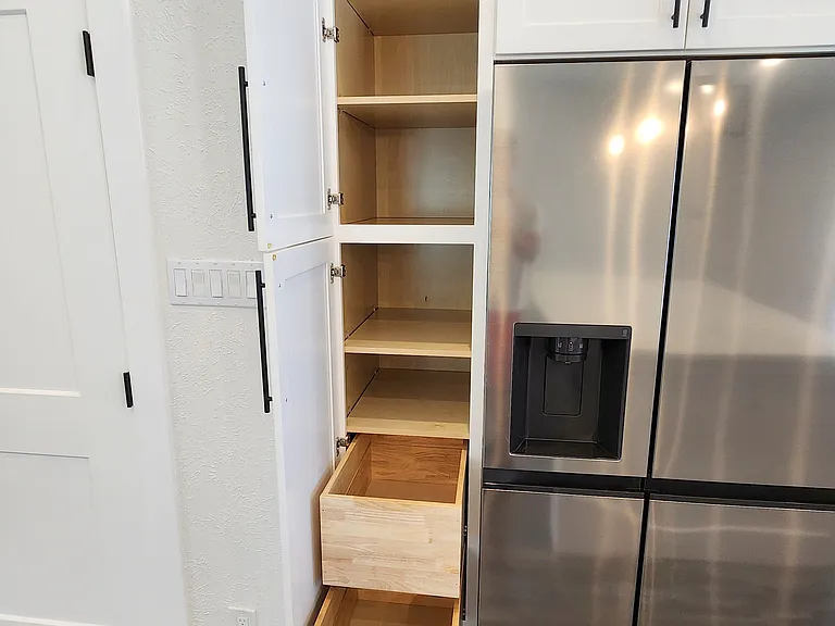 Pantry cabinet with pull out drawers