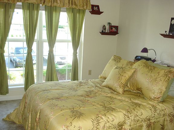 Bedroom with view of the pool