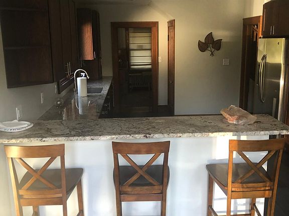 Completely updates kitchen with custom cabinets, gas range and stainless steal appliances.