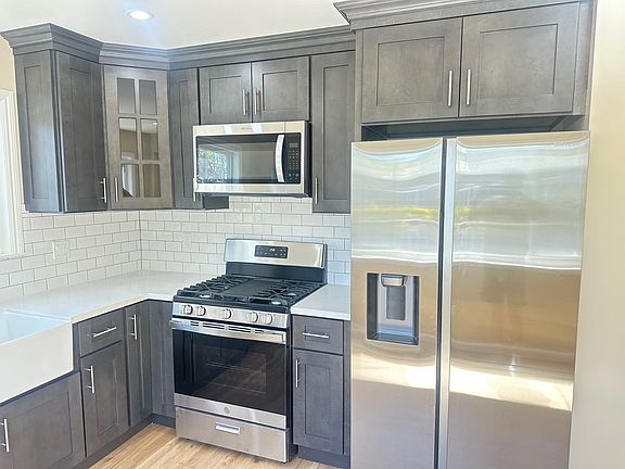 Gas Range and Stainless Fridge