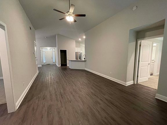 Living looking towards the front door/kitchen.