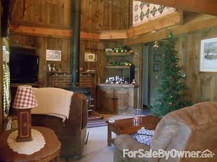Downstairs
						:
						Living room with wood burner