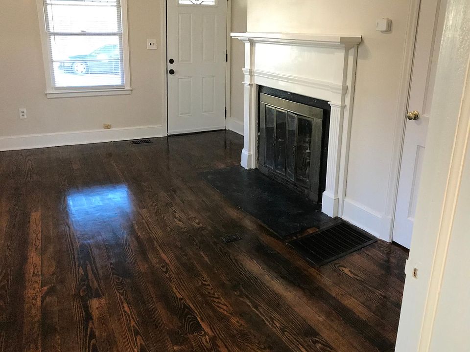 Living Room - refinished hardwood floors and fireplace. Size: 17 x 17