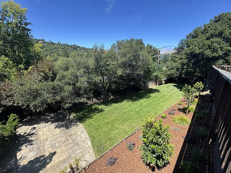 Lawn space, trees and views of the hills.