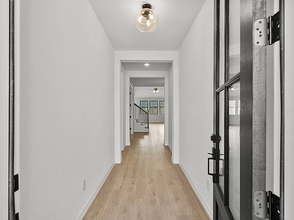 An inviting entry sets the tone, opening into a bright and spacious open-concept design.