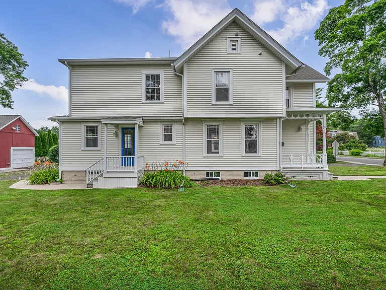 Side view of home level lot with lawn area.