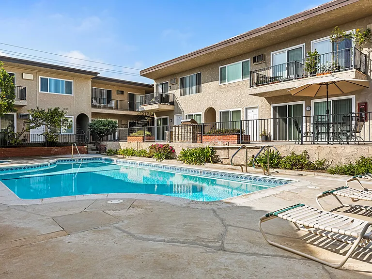 Large pool beside spacious patio (not visible here) with two commercial barbecues