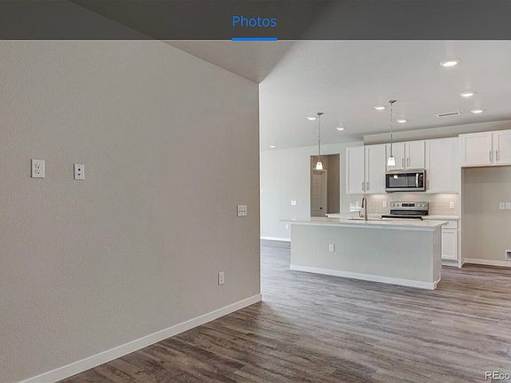 Den/Office looking out to Kitchen. Kitchen comes with Refrigerator, wall-rack pot holder and rolling utility cart - purchased 2021