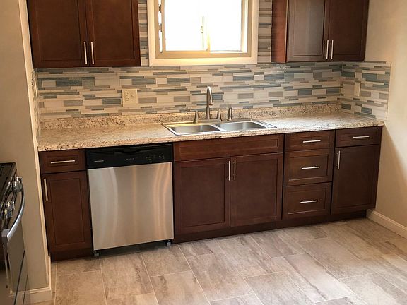 Kitchen with dishwasher, microwave, stove and refrigerator