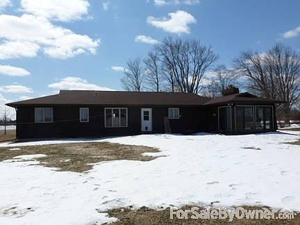 Back of the house
						:
						Back of the house featuring the sun room.