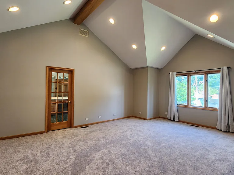 Huge primary bedroom with vaulted ceilings