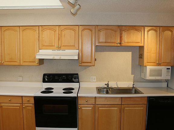 Kitchen has lots of storage and large skylight