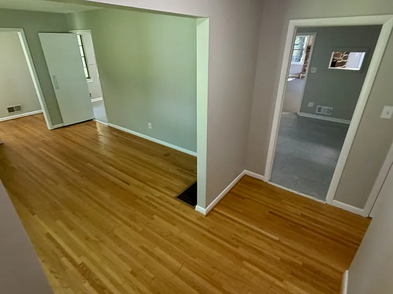 View from front door, left is study area & laundry rm, ahead is kitchen, right hallway to bedrooms