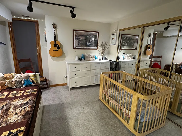 Large closet behind mirrored sliding doors