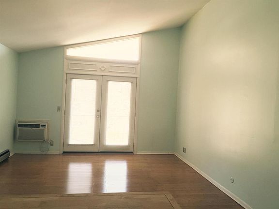 The high vaulted ceiling makes the space feel warm, fresh, a