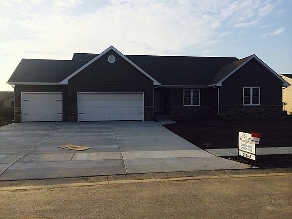 3 car garage and stone