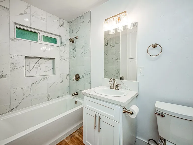 Nice Bathroom with Tiled Shower.