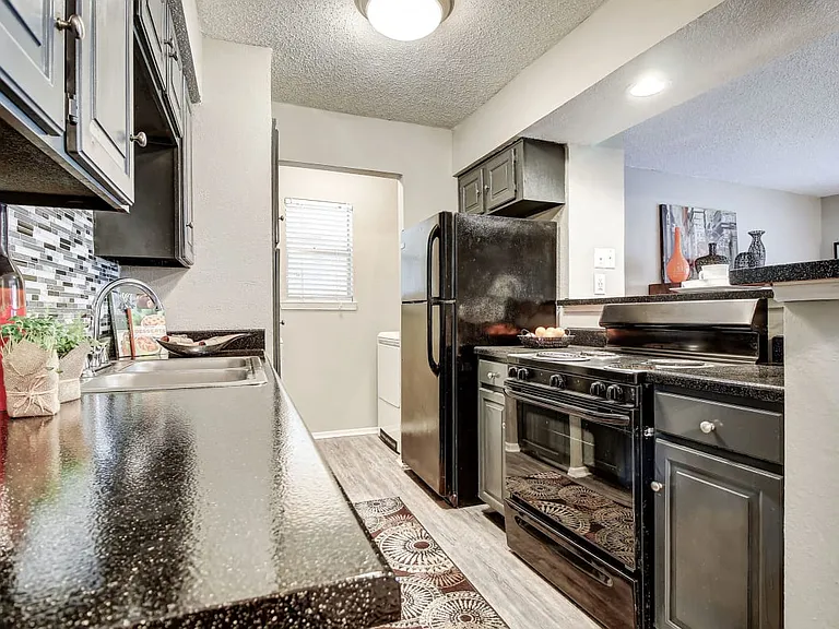 Spacious Kitchen with Black Appliances