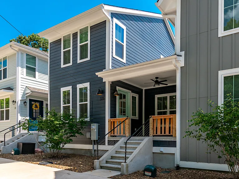 Lovely dark blue townhome. A must see!