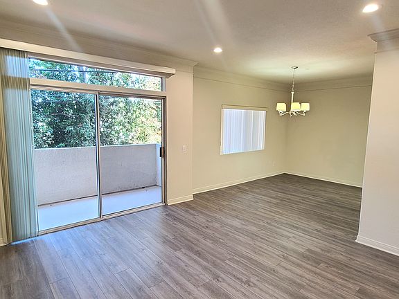 The apartment is in the rear of building away from traffic and noise, overlooking the trees, pool, and patio.