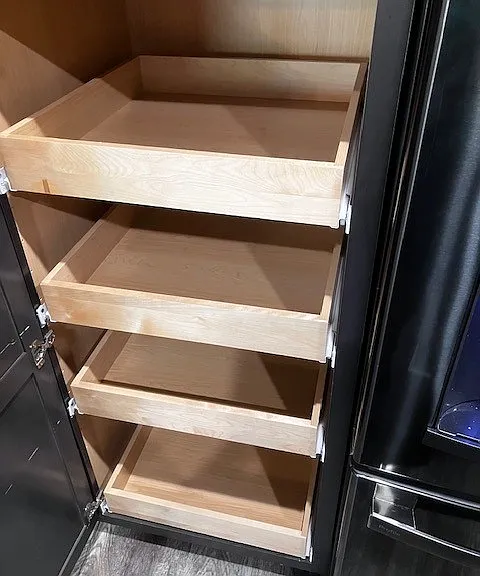 Built in storage in kitchen along with under staircase storage.