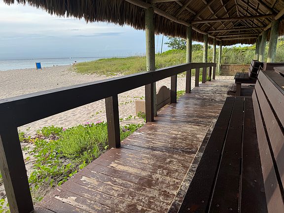 Seated area in front of the beach shaded