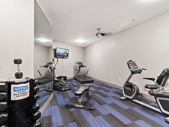 State of the art fitness center with free weights and TV