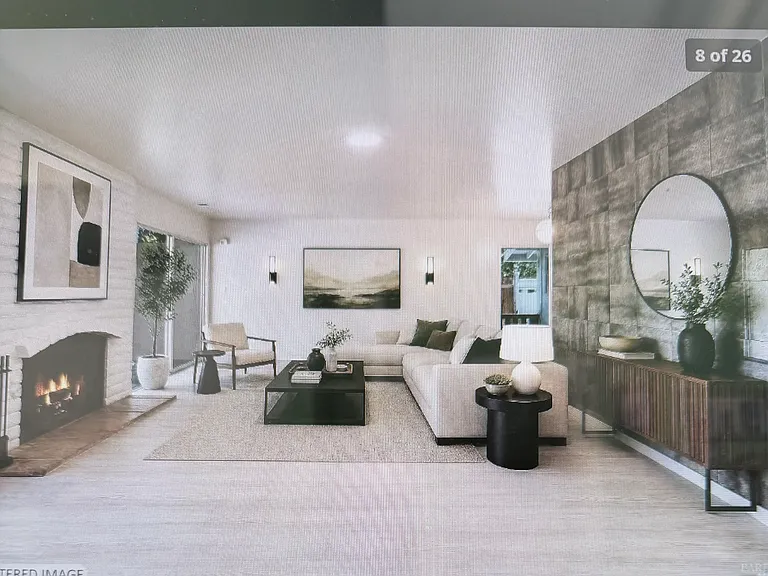living room with the mirrored wall