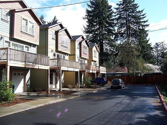 Paved private drive in woodsy setting