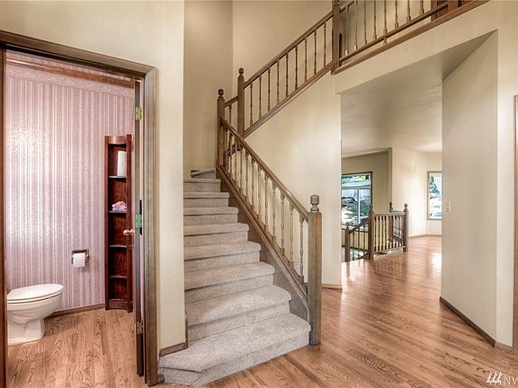 Soaring 2 story entry with hardwood floors
