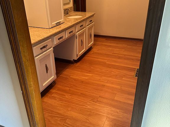 Newly renovated master bathroom, separate vanity from toilet and bathtub and hardwood floor