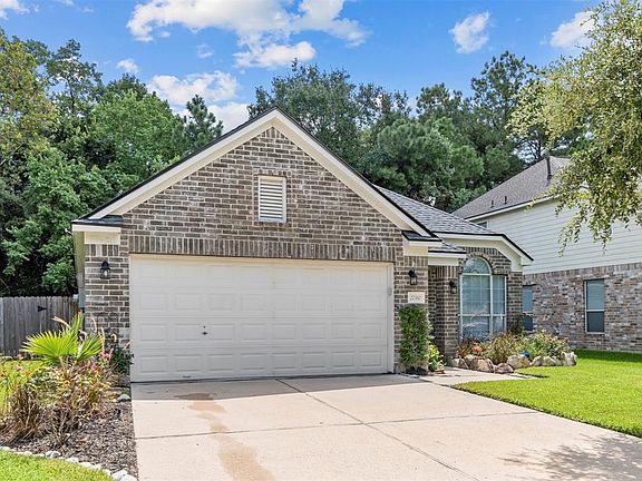 Garage includes upgraded garage door opener and numerical keypad on right side of garage.