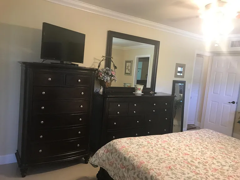 view of master dresser and doorway