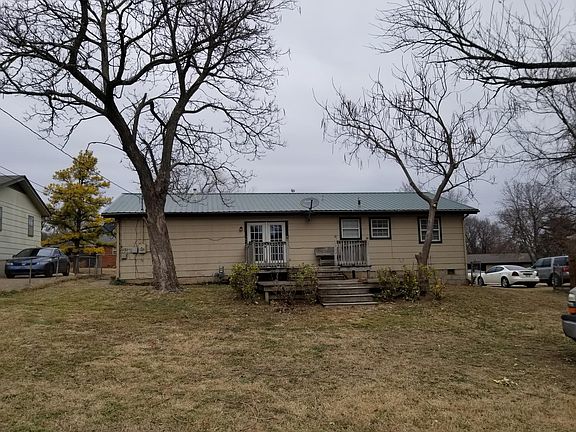 Back of house with wood deck