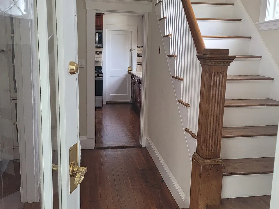 Staircase connected to Kitchen and Living Room