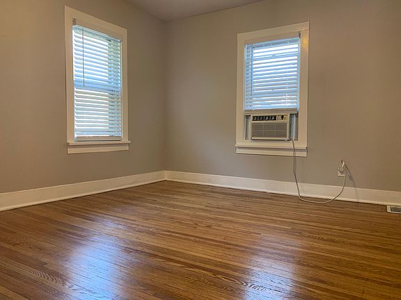 Hardwood floors continue into the bedroom.
