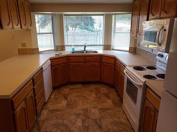 Kitchen -- new dishwasher a, refrigerator, and microwave