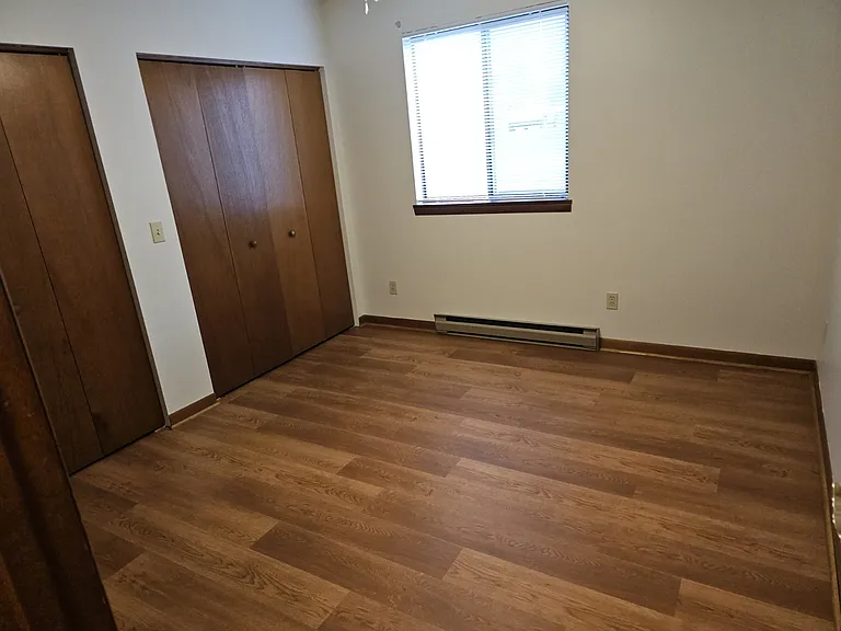 Larger bedroom with ceiling fan
11x12 with alcove