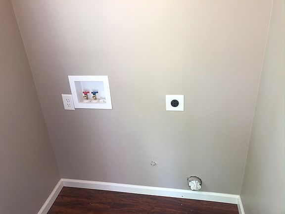 In entry room, main room and kitchen to right.