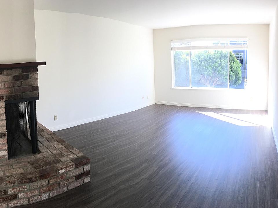 Living room with fireplace and new flooring