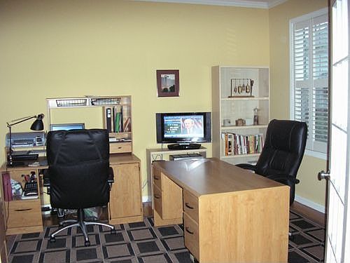 Office/Living Rm with plantation shutters, hardwoods