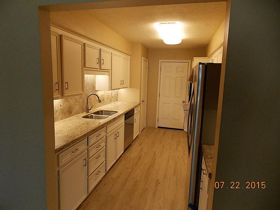 New appliances in Kitchen with granite and tile.
