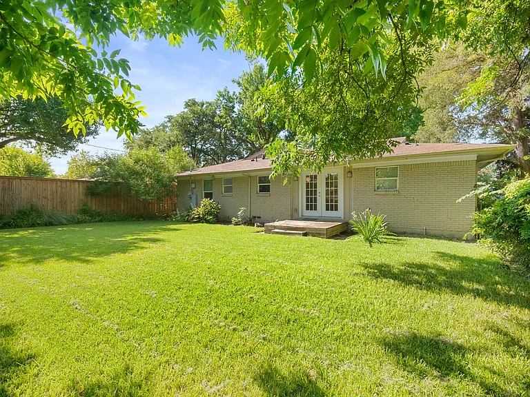 Large backyard with afternoon shade.