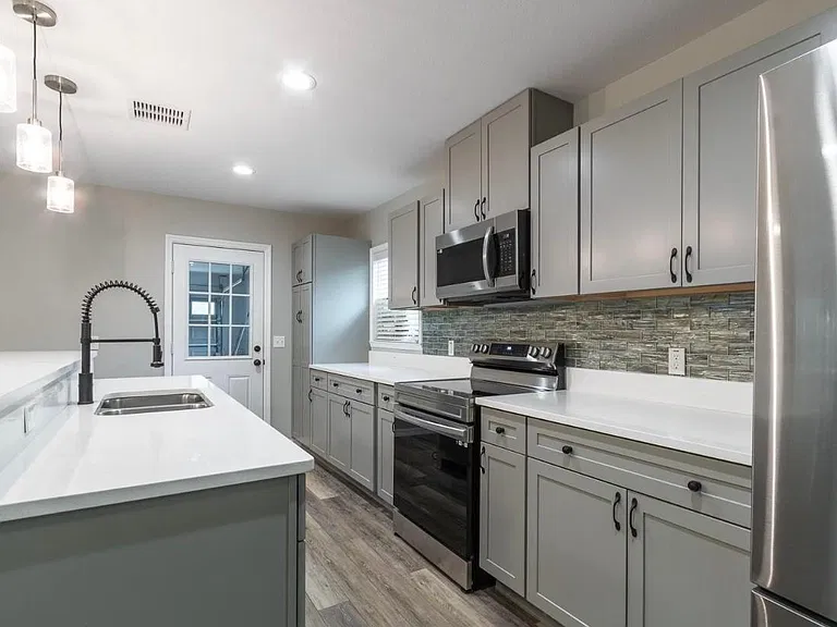 Open kitchen with stone countertops!