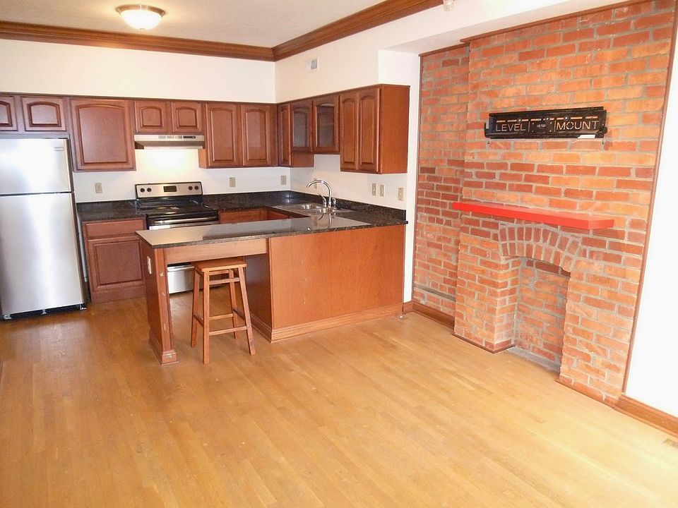 Exposed brick decorative fireplace