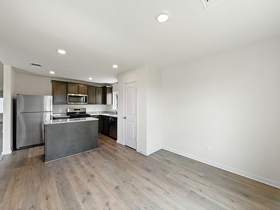 The dining room sits right off of the kitchen.